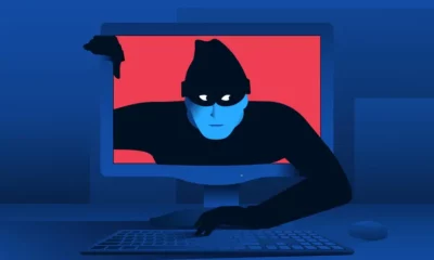 Illustration of a hacker emerging from computer screen.